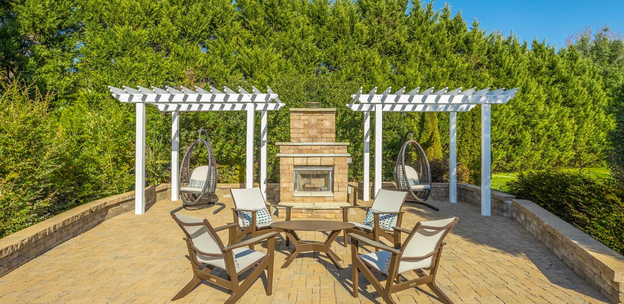 Hawthorne Park South apartment community exterior with volleyball court and pool area