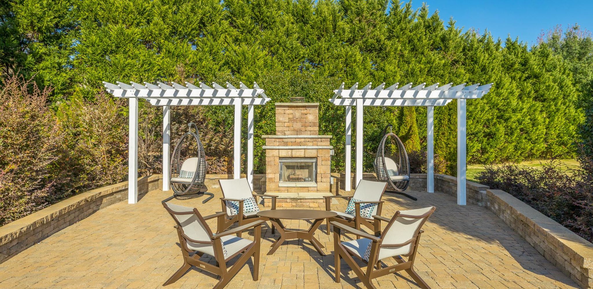 Hawthorne Park South apartment community exterior with volleyball court and pool area