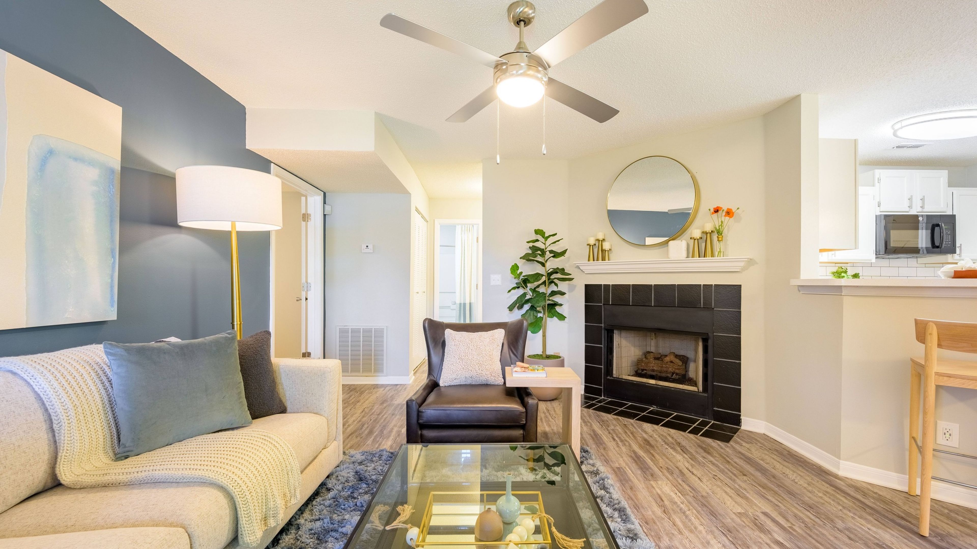 Hawthorne Park South apartment kitchen and living space with kitchen island and fireplace